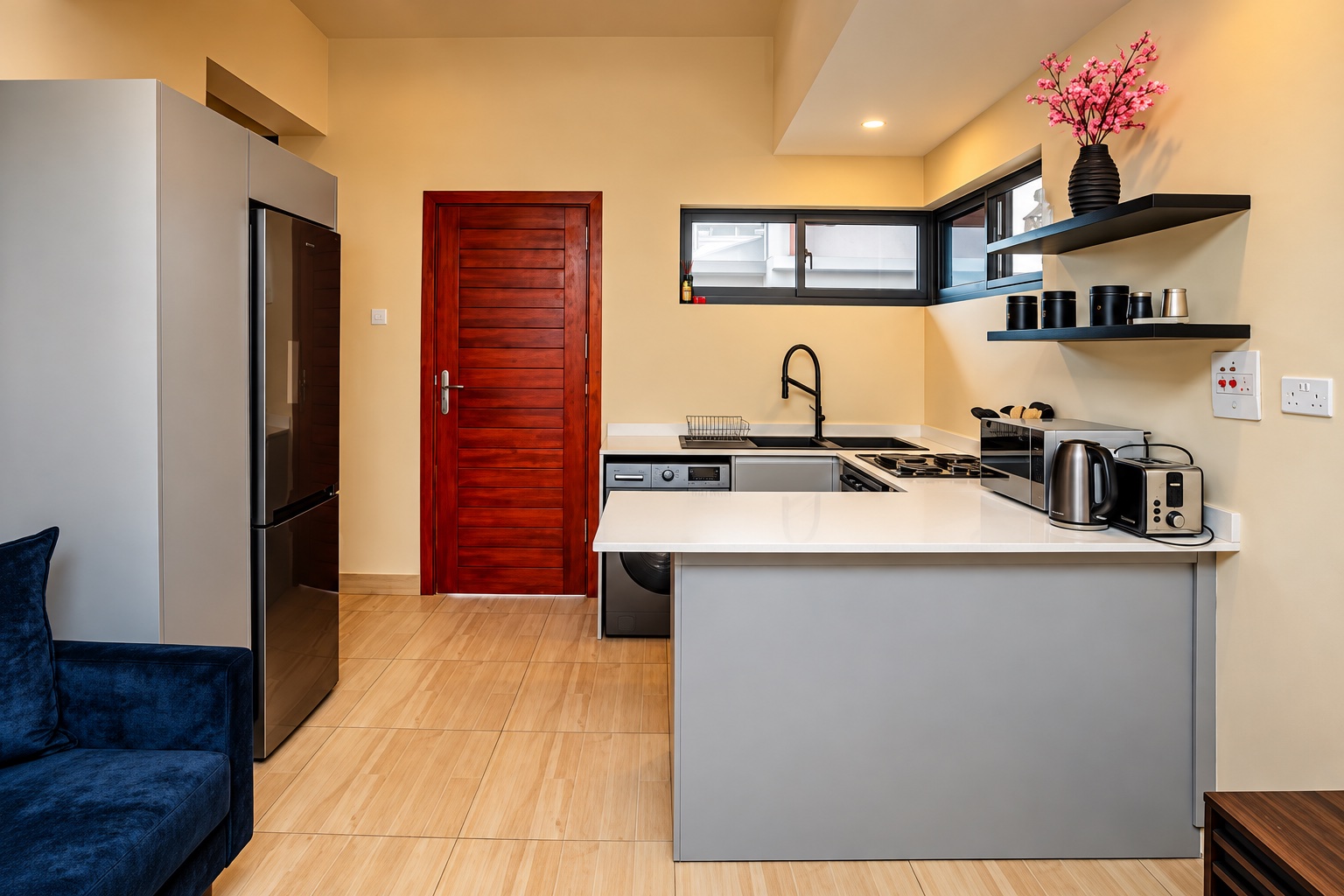 Equipped apartment kitchen with a fridge, washing machine and stove